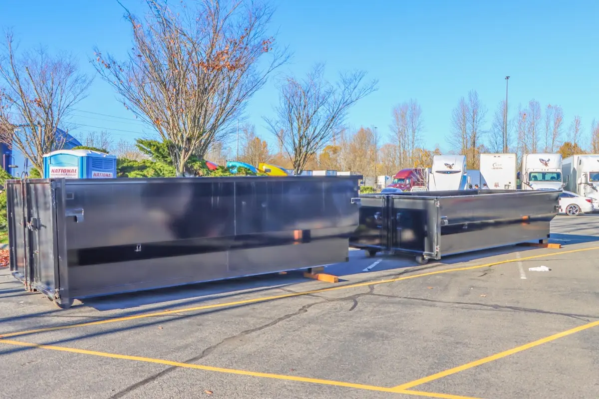 Professional dumpster rental service with roll-off container on residential driveway in Aberdeen